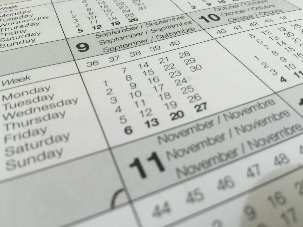 pexels-photo-273153-273153 Detailed close-up of a calendar displaying months in several languages.