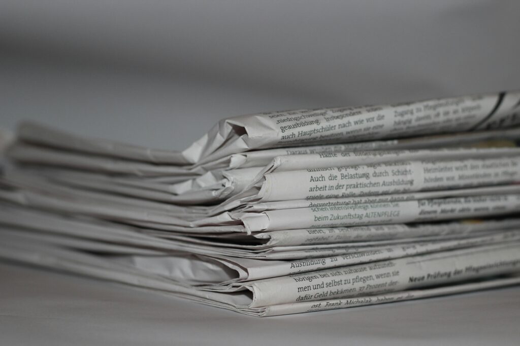 news-newsletter-newspaper-information-158651-158651 A close-up image of folded newspapers, perfect for news or journalism themes.